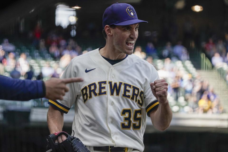 Milwaukee Brewers' Brent Suter reacts after Lorenzo Cain threw out St. Louis Cardinals' Tommy Edman at home during the sixth inning of a baseball game Thursday, May 13, 2021, in Milwaukee. (AP Photo/Morry Gash)