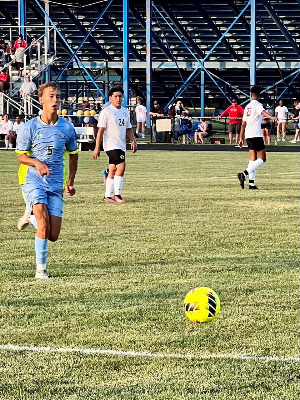 River Valley's Hudson Pollock runs down a ball during a boys soccer match with Marion Harding earlier this season at RV.