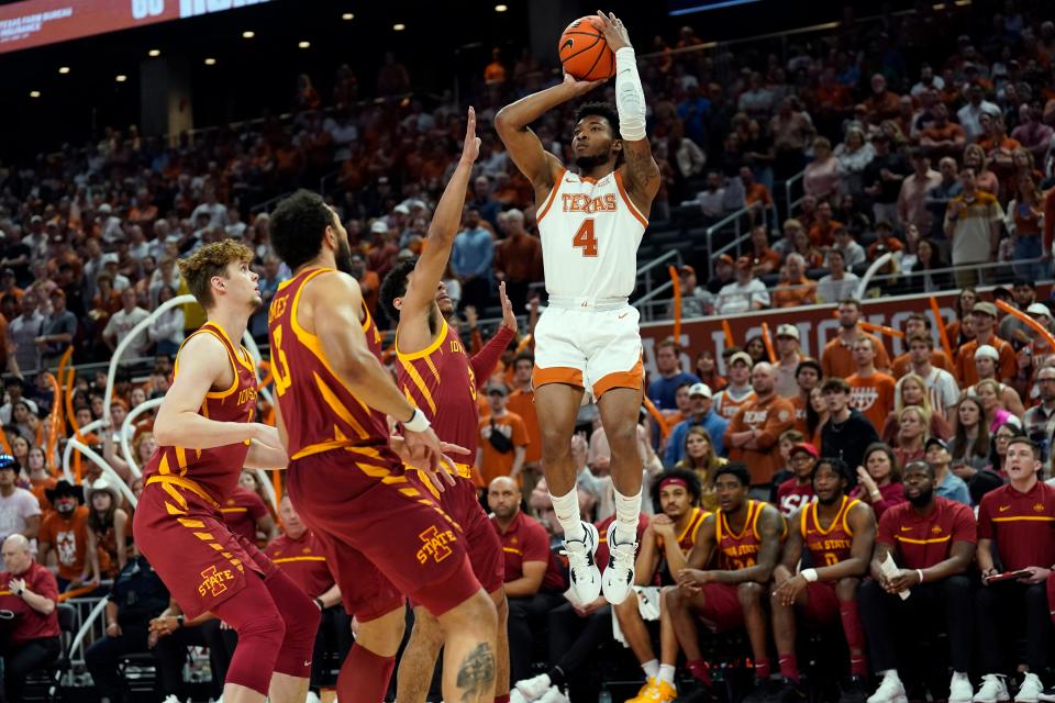 Texas point guard Tyrese Hunter shoots over Iowa State defenders Tamin Lipsey, Gabe Kalscheur and other Cyclones during the first half of Tuesday night's 72-54 win at Moody Center. The sharp-shooting Longhorns shot 55% from the field in the first half.