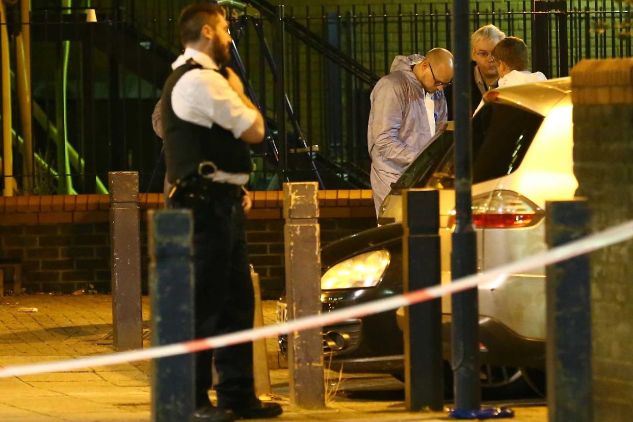 Police and Forensic Staff at the Crime Scene in Battersea: NIGEL HOWARD