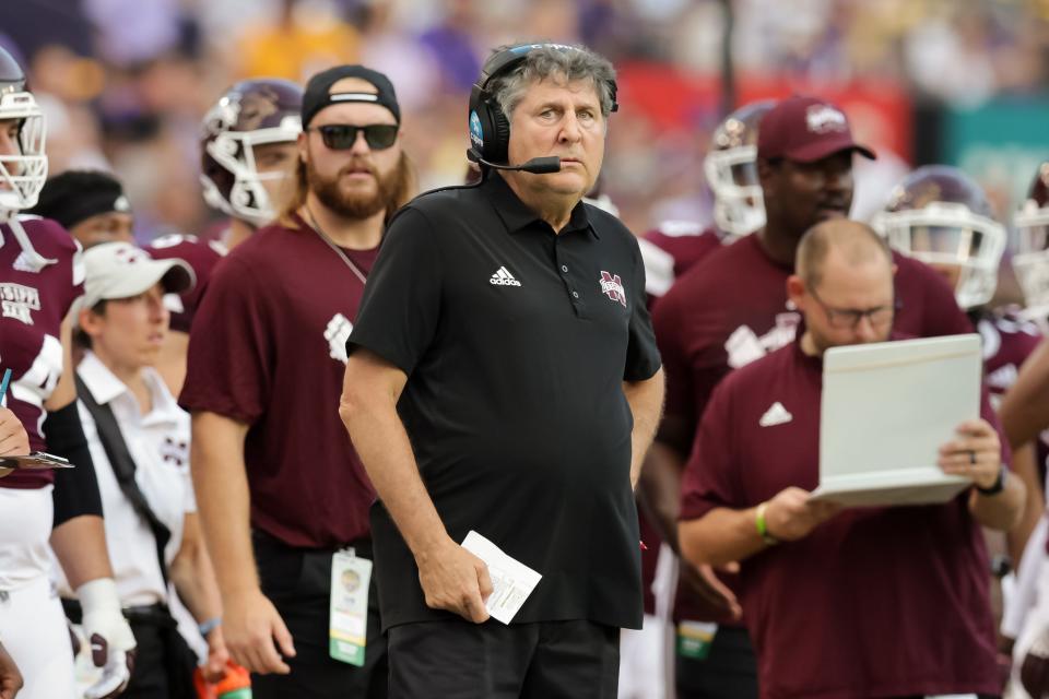 Mississippi State Bulldogs head coach Mike Leach looks on against the LSU Tigers during the first half at Tiger Stadium. Mike Leach, the gruff, pioneering and unfiltered college football coach who helped revolutionize the passing game with the Air Raid offense, has died following complications from a heart condition, Mississippi State said Tuesday, Dec. 13, 2022. He was 61. 