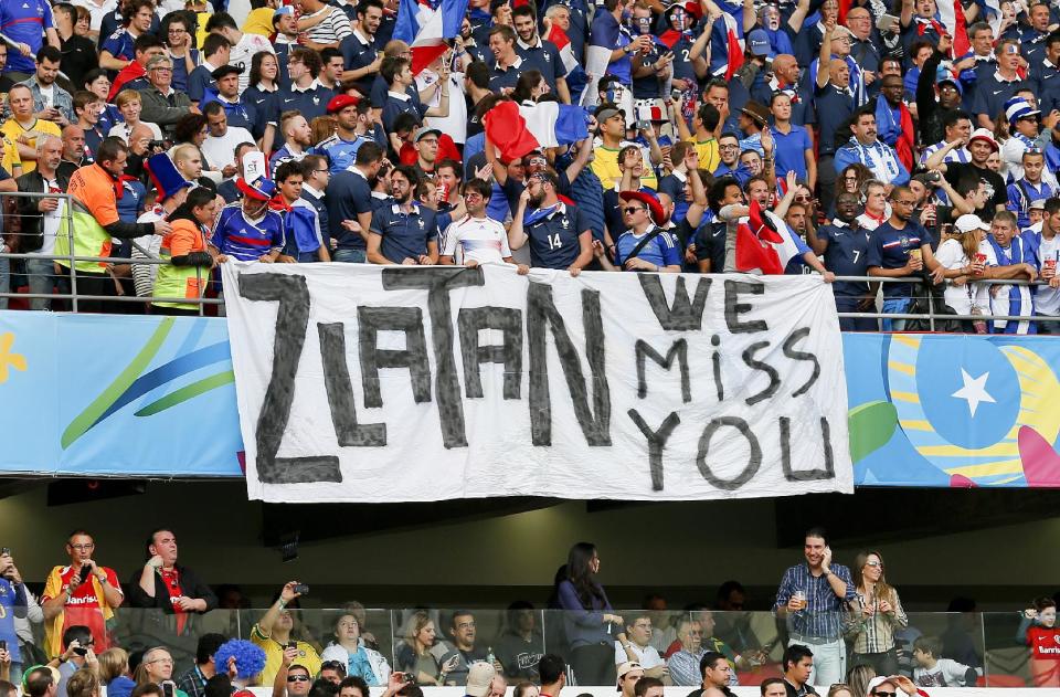 French supporters hold a banner referring to Swedish player Zlatan Ibrahimovic before the group E World Cup soccer match between France and Honduras at the Estadio Beira-Rio in Porto Alegre, Brazil, Sunday, June 15, 2014. Zlatan plays for PSG in the French league and is not in Brazil as Sweden did not qualify. (AP Photo/Jon Super)