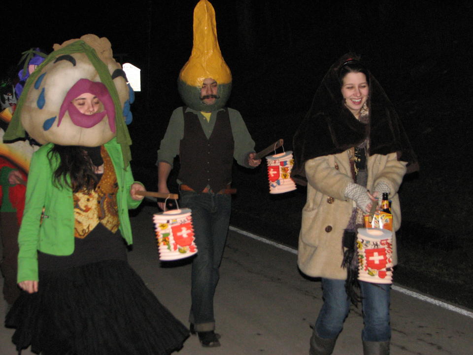 This Feb. 18, 2012 photo provided by HelvetiaWV.com shows parade participants wearing costumes and holding Lampions, which are paper candle lantern that are carried on sticks, at the 2012 Fasnacht in Helvetia W.Va. Deep in the mountains of West Virginia, the descendants of Swiss and German immigrants have Fasnacht, which like Mardi Gras, is a last hurrah before Lent as well as chasing away winter. (AP Photo/HelvetiaWV.com)