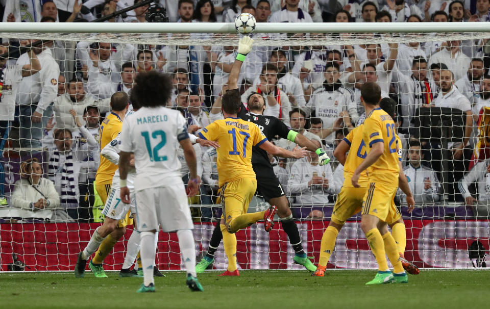 <p>Soccer Football – Champions League Quarter Final Second Leg – Real Madrid vs Juventus – Santiago Bernabeu, Madrid, Spain – April 11, 2018 Real Madrid’s Raphael Varane (hidden) hits the bar REUTERS/Susana Vera </p>