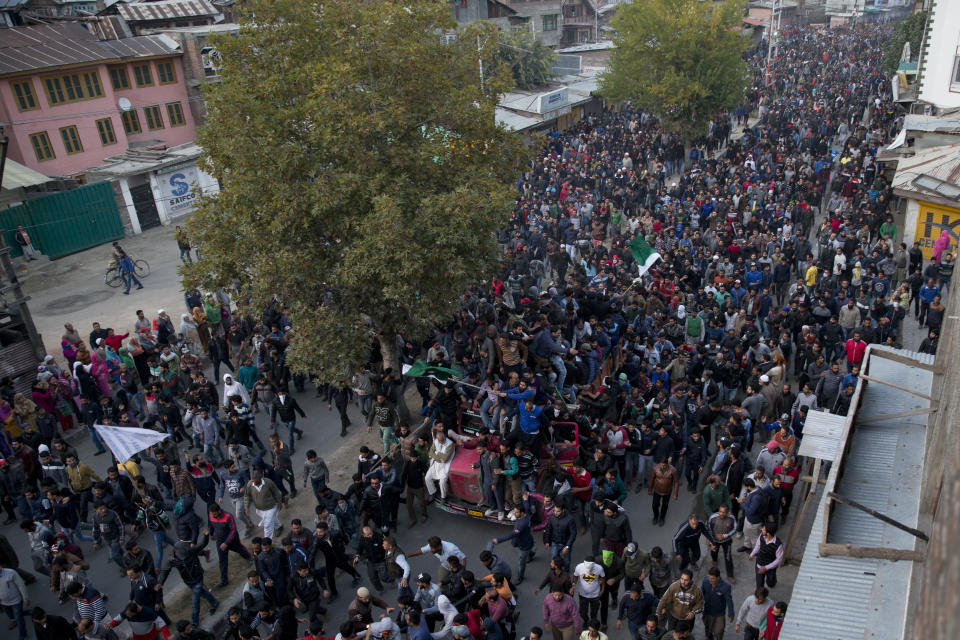 Kashmiri Muslims take part in joint funeral of two rebels and a civilian after they were killed in a gunbattle in Srinagar, India, Wednesday, Oct. 17, 2018. Anti-India protests and clashes erupted in the main city in disputed Kashmir on Wednesday after a gunbattle between militants and government forces killed at least two suspected rebels, a civilian and a counterinsurgency police official, residents and police said. (AP Photo/Dar Yasin)