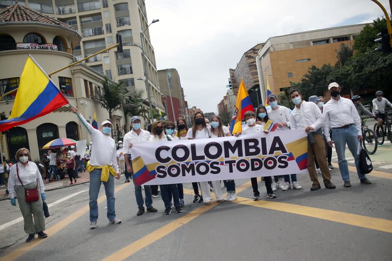 People march against road blockades in Bogota