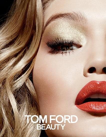 <p>Hadid also fronted the holiday 2014 campaign, looking festive with a golden eye and striking red lip.<br></p>