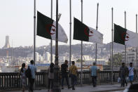 Algerian flags fly at half-staff along the seaside walk in Algiers, Saturday, Sept. 18, 2021. Algeria's leader declared a three-day period of mourning starting Saturday for former President Abdelaziz Bouteflika, whose 20-year-long rule, riddled with corruption, ended in disgrace as he was pushed from power amid huge street protests when he decided to seek a new term. Bouteflika, who had been ailing since a stroke in 2013, died Friday at 84. (AP Photo/Fateh Guidoum)