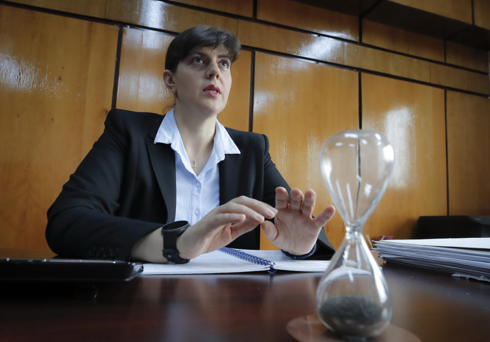 In this photo taken on Friday, Oct. 4, 2019, Laura Codruta Kovesi, Romania's former chief anti-corruption prosecutor who will direct the European Public Prosecutor's Office (EPPO) - tasked with investigating fraud connected to the use of EU funds and other financial crimes, speaks during an interview with the Associated Press, in Bucharest, Romania. For Kovesi, opposition to her successful candidacy to become the European Union’s first chief prosecutor came from a familiar source - her own country’s government. Kovesi spent five years as head of the Romanian Anticorruption Directorate and those indicted by her office included 14 Cabinet members, 53 lawmakers and a member of the European Parliament. (AP Photo/Vadim Ghirda)