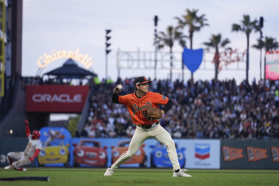 San Francisco Giants pitcher Spencer Howard throws to first for the out on Los Angeles Angels' Zach Neto during the third inning of a baseball game Friday, June 14, 2024, in San Francisco. Kevin Pillar and Logan O'Hoppe advanced to third and second, respectively, on Neto's sacrifice bunt. (AP Photo/Godofredo A. Vásquez)