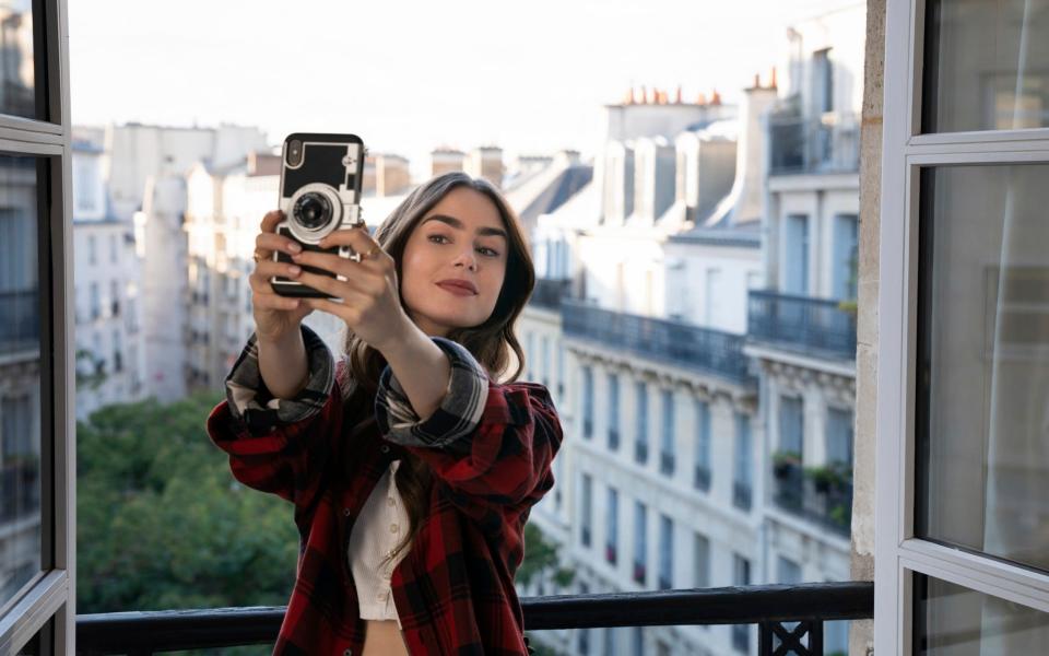 Lily Collins in a scene from the series "Emily in Paris"  - Stephanie Branchu /Television Stills 