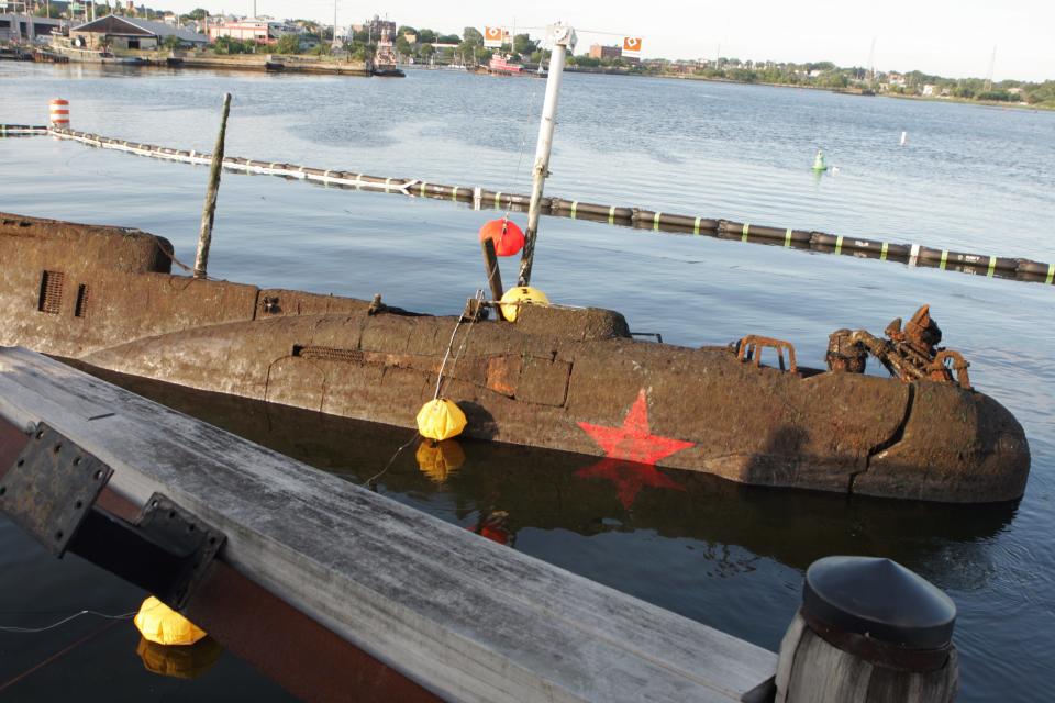 Juliett 484, a Soviet-era sub that sank during a storm in 2007, is pulled from the bottom of Providence Harbor by a Navy salvage unit in June 2008. It was the first of many salvage vessels handled by Rhode Island Recycled Metals.