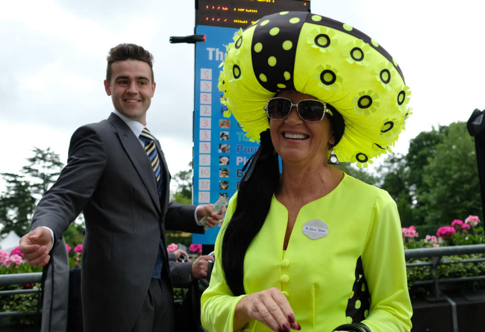 Rebecca Johnson wearing, what looks like, some kind of florescent inflatable device on her head. 