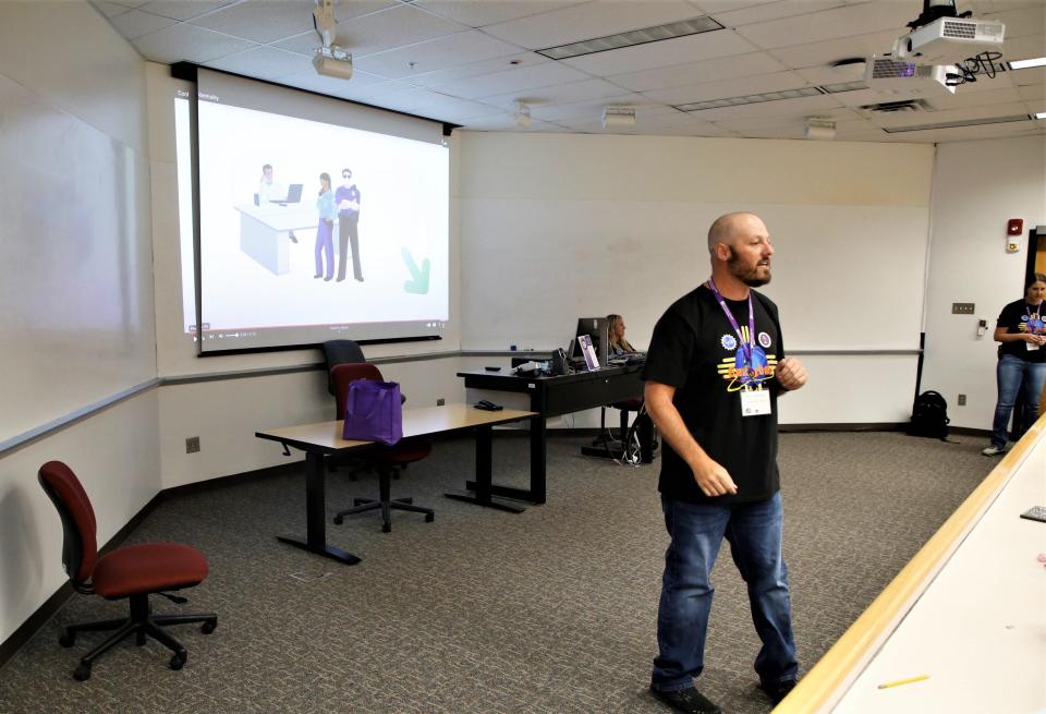 Instructor Kevin Beckner leads GenCyber Camp students through on exercise in password security on Monday, June 26 at San Juan College in Farmington.