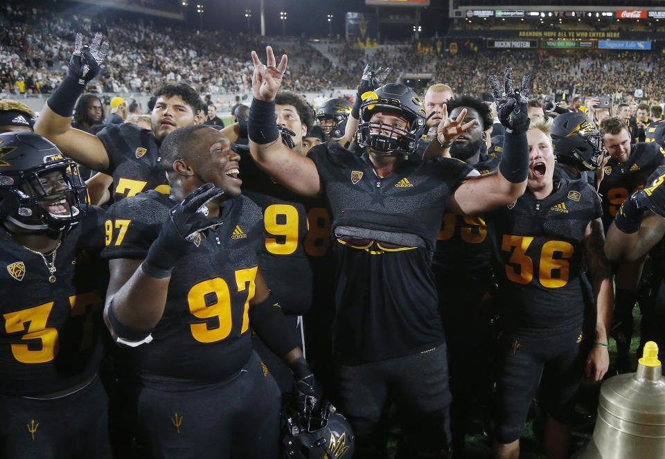 Front from left to right; Arizona State' Darien Butler, Shannon Forman, Jarrett Bell, and Michael Sleep-Dalton celebrate with teammates after an NCAA college football game win against Michigan State Saturday, Sept. 8, 2018, in Tempe, Ariz. Arizona State defeated Michigan State 16-13. (AP Photo/Ross D. Franklin)