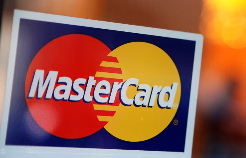 A MasterCard logo is seen on a door outside a restaurant in New York, February 3, 2010. REUTERS/Shannon Stapleton