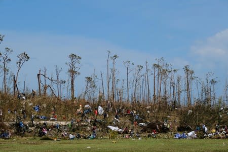 Displaced Haitian nationals take refuge on the grounds of the Government Complex during the aftermath of Hurricane Dorian in Marsh Harbour