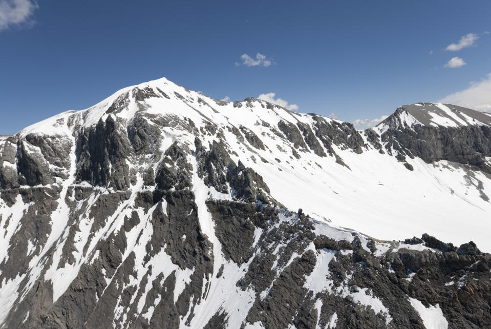 FILE - In this Saturday, May 30, 2009 photo Mount Piz Segnas and the Atlas, back right, are pictured in Switzerland. Police in southeastern Graubuenden canton (state) said a several-seater plane crashed Saturday on the Piz Segnas mountain above the Swiss Alpine resort of Flims, striking the mountain's western flank about 2,540 meters (8,330 feet) above sea level. There was no immediate word on casualties. (Arno Balzarini/Keystone via AP, file)