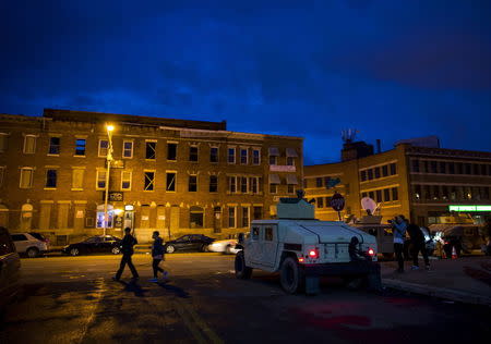 National Guard troops are seen at North Ave and Pennsylvania Ave in Baltimore, Maryland April 30, 2015. REUTERS/Eric Thayer