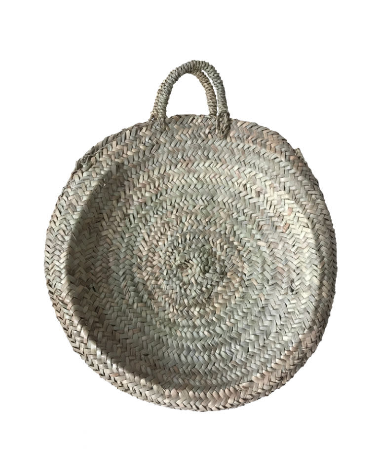 <p>Circular woven basket, <a rel="nofollow noopener" href="https://edit58.com/collections/baskets/products/circular-woven-basket" target="_blank" data-ylk="slk:£40;elm:context_link;itc:0;sec:content-canvas" class="link ">£40</a> </p>