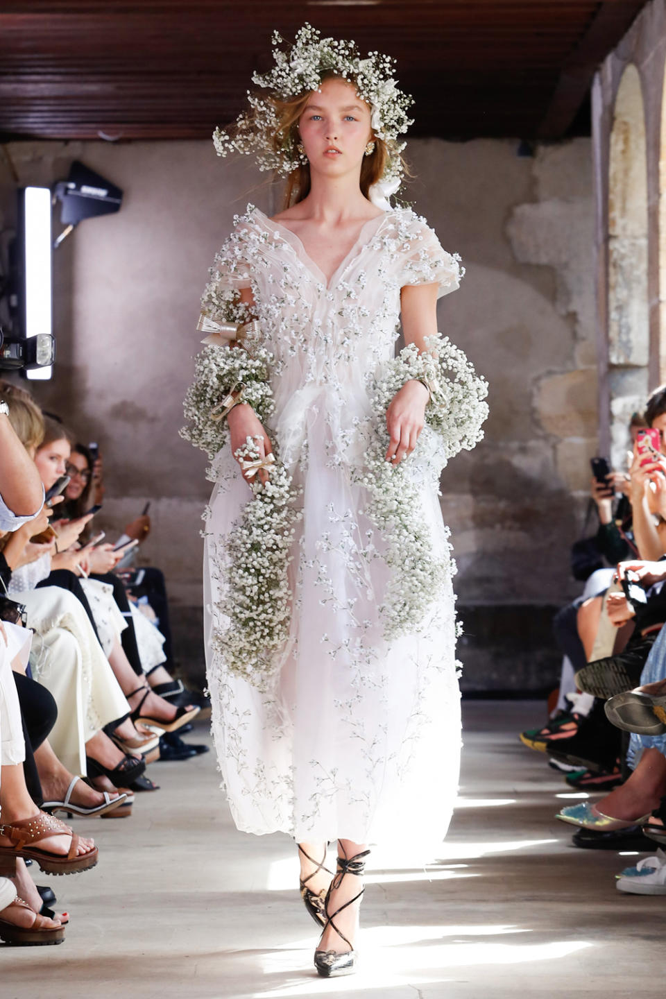 <p><i>White wedding gown with floral appliqués from the SS18 Rodarte collection. (Photo: ImaxTree) </i></p>