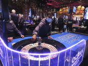 A dealer wearing a face mask conducts a game of roulette at the Ocean Casino Resort in Atlantic City, N.J. on Dec. 2, 2022. The New Jersey Supreme Court is expected to hear arguments, Wednesday, Sept. 27, 2023, in a case involving whether insurance companies were correct in denying payouts to the casino for business losses during the state-mandated closure in 2020. (AP Photo/Wayne Parry)