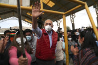 Carlos Mesa, who is running for president with the Citizen Community party, waves to supporters after voting during general elections in La Paz, Bolivia, Sunday, Oct. 18, 2020. (AP Photo/Martin Mejia)