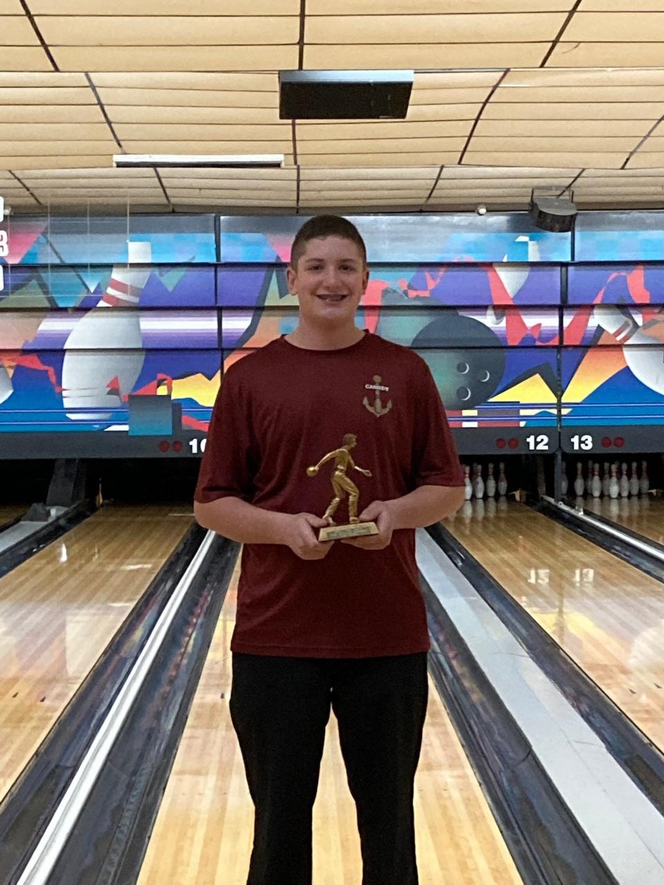 Arlington bowler Braden Cassidy poses with his trophy after finishing with the highest series in the DeStefano tournament on Jan. 15, 2022.