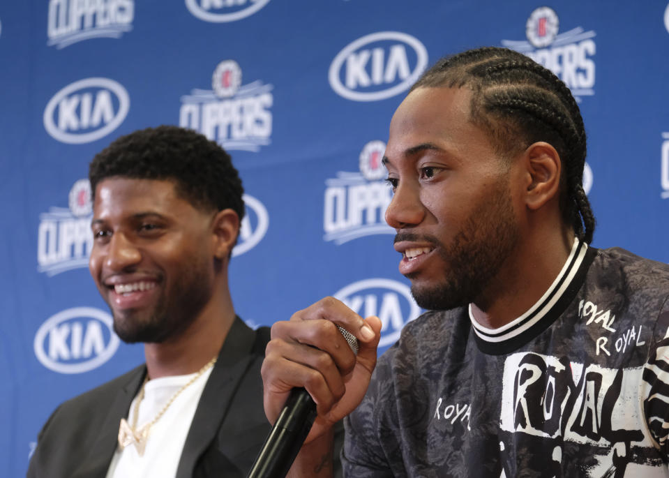 Los Angeles Clippers NBA basketball team introduce Paul George and Kawhi Leonard at a press conference at the Green Meadows Recreation Center in Los Angeles, Wednesday, July 23, 2019. (AP Photo/Ringo H.W. Chiu)