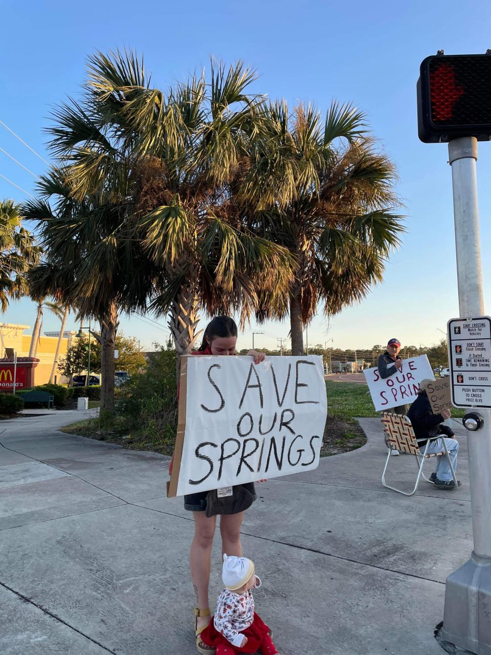 Residents seeking to persuade the North Port City Commission to abandon its plan to develop vacant park land adjacent to Warm Mineral Springs, rallied at the intersection of Price and Sumter boulevards on Dec. 23. Another rally was scheduled for Dec. 30.