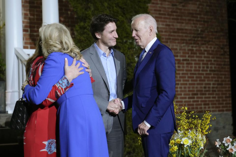 President Joe Biden and first lady Jill Biden are greeted by Canadian Prime Minister Justin Trudeau and his wife Sophie Gregoire Trudeau at Rideau Cottage, Thursday, March 23, 2023, in Ottawa, Canada. 