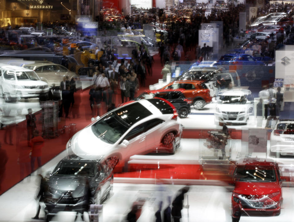 In this long-time exposed picture a general view is photographed at hall 5 on Wednesday, March 7, 2012 during the press preview days at the 82nd Geneva International Motor Show in Geneva, Switzerland.The Motor Show will open it's doors to public from 8th to the 18th of March presenting more than 260 exhibitors and more than 180 world and European premieres. (AP Photo/Frank Augstein)