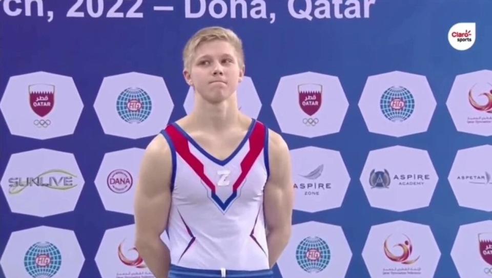 Russian gymnast Ivan Kuliak stands on the podium