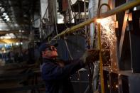 An employee prepares a facility for producing fire trucks, as the factory was relocated from Chernihiv region to Lviv amid Russia's invasion