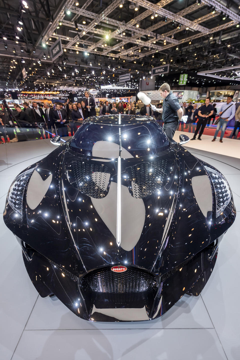 The New car Bugatti La voiture Noire is presented during the press day at the '89th Geneva International Motor Show' in Geneva, Switzerland, Tuesday, March 5, 2019. The 'Geneva International Motor Show' takes place in Switzerland from March 7 until March 17, 2019. Automakers are rolling out new electric and hybrid models at the show as they get ready to meet tougher emissions requirements in Europe - while not forgetting the profitable and popular SUVs and SUV-like crossovers. (Martial Trezzini/Keystone via AP)