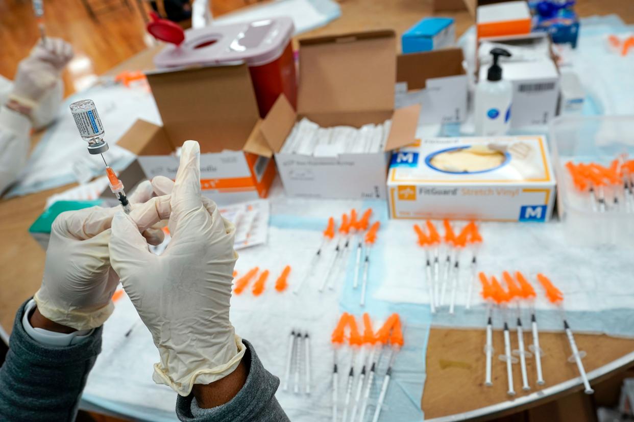 A Northwell Health registered nurse fills a syringe with a COVID-19 vaccine at a pop-up vaccination site at the Albanian Islamic Cultural Center, April 8, 2021, in Staten Island, New York.