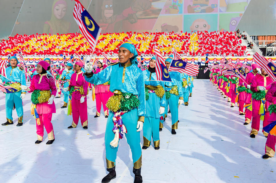 <p>Malaysian schoolchildren perform during the 59th National Day celebrations to commemorate the independence of the Federation at the Independence Square in Kuala Lumpur. (Chris Jung/NurPhoto via Getty Images)<br><br></p>