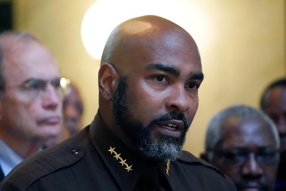 Hinds County Sheriff Tyree Jones, stands with state elected officials, Hinds County legislators, supervisors, and other lawmen, and speaks to reporters about the Hinds County Public Safety Initiative, a project they believe will address crime in Hinds County through temporary judges, assistant district attorneys, and public defenders, Wednesday, May 4, 2022, in Jackson, Miss.