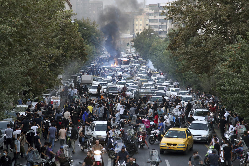 FILE - In this photo taken by an individual not employed by the Associated Press and obtained by the AP outside Iran, protesters chant slogans during a protest over the death of a woman who was detained by the morality police, in downtown Tehran, Iran on Sept. 21, 2022. The widespread resolve against Russia's invasion of Ukraine demonstrates the power of a unified response against human rights abuses, a leading watchdog group said Thursday, Jan. 12, 2023, and comes amid growing dissatisfaction with autocratic regimes, with protests in Iran, China and elsewhere. (AP Photo, File )