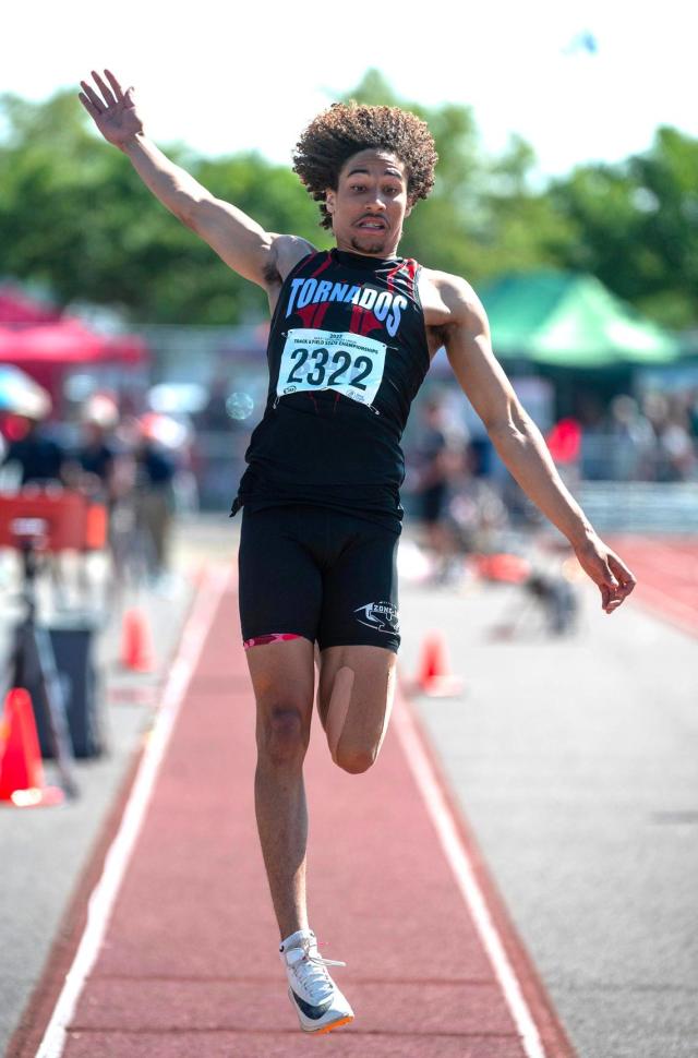 Yelm&#x002019;s Trevontay Smith leaps to a second-place finish in the 3A boys long jump competition during the second day of the WIAA state track and field championships at Mount Tahoma High School in Tacoma, Washington, on Friday, May 26, 2023.