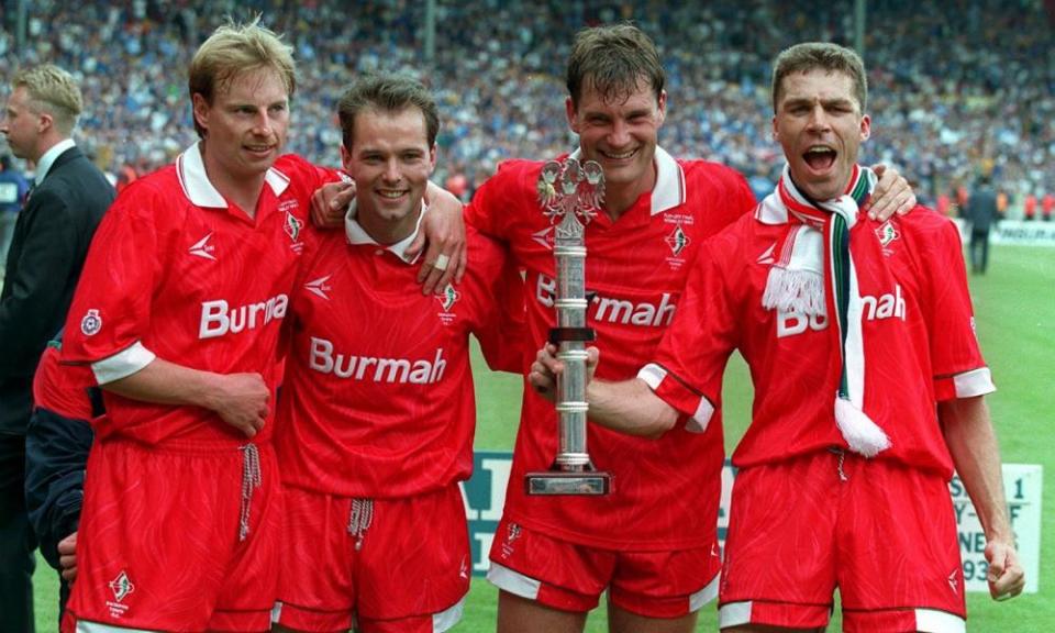 Swindon’s player-manager, Glenn Hoddle, celebrates alongside three of his teammates following promotion to the top-flight. Hoddle would soon leave to take charge at Chelsea