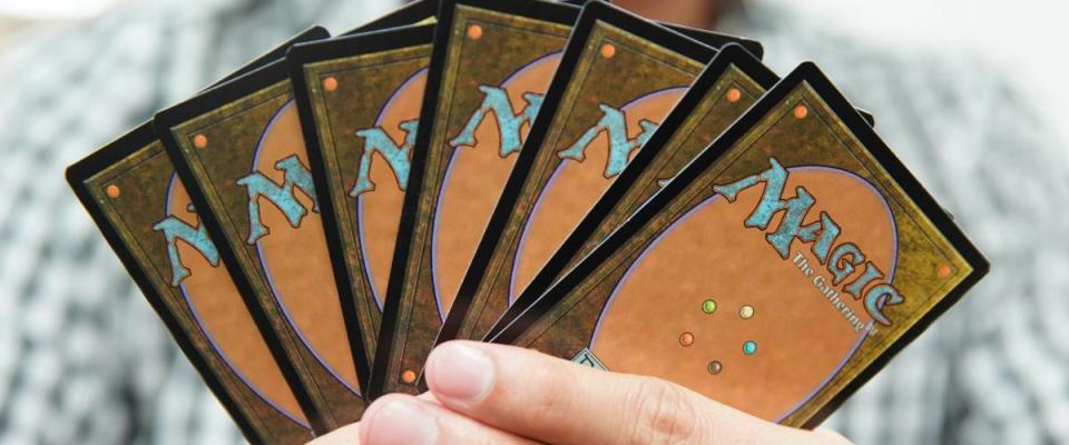 BANGKOK, THAILAND - JULY 6: The Land cards of game Magic: The Gathering on Player Hand on July 6,2017.