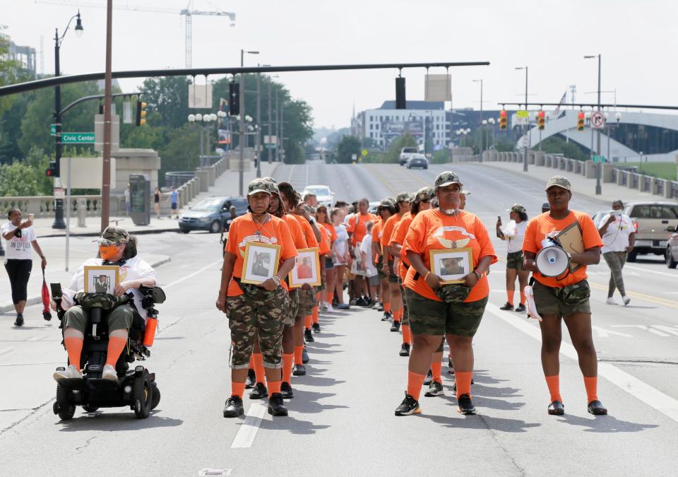 Mothers of Murdered Columbus Children line up on Broad Street to march during an anti-gun violence rally at Columbus City Hall on Sunday, August 1, 2021. Founder Malissa Thomas-St. Clair stands second from the right.