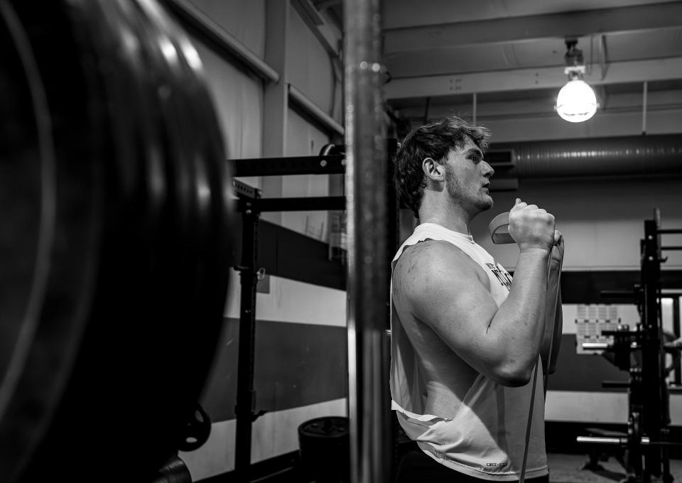 North Oldham offensive lineman Gradey Anthony worked out in the weight room before a March practice.