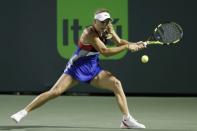 Mar 23, 2018; Key Biscayne, FL, USA; Caroline Wozniacki of Denmark hits a backhand against Monica Puig of Puerto Rico (not pictured) on day four of the Miami Open at Tennis Center at Crandon Park. Mandatory Credit: Geoff Burke-USA TODAY Sports