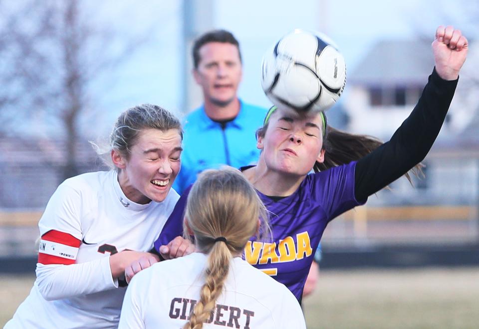 Nevada forward Avery Anderson (15) and Gilbert midfielder Nora Kalvik (28) attempt to head the ball during the first half of the Cubs' 3-2 shootout win at Cub Stadium on Monday, March 27, 2023, in Nevada, Iowa.