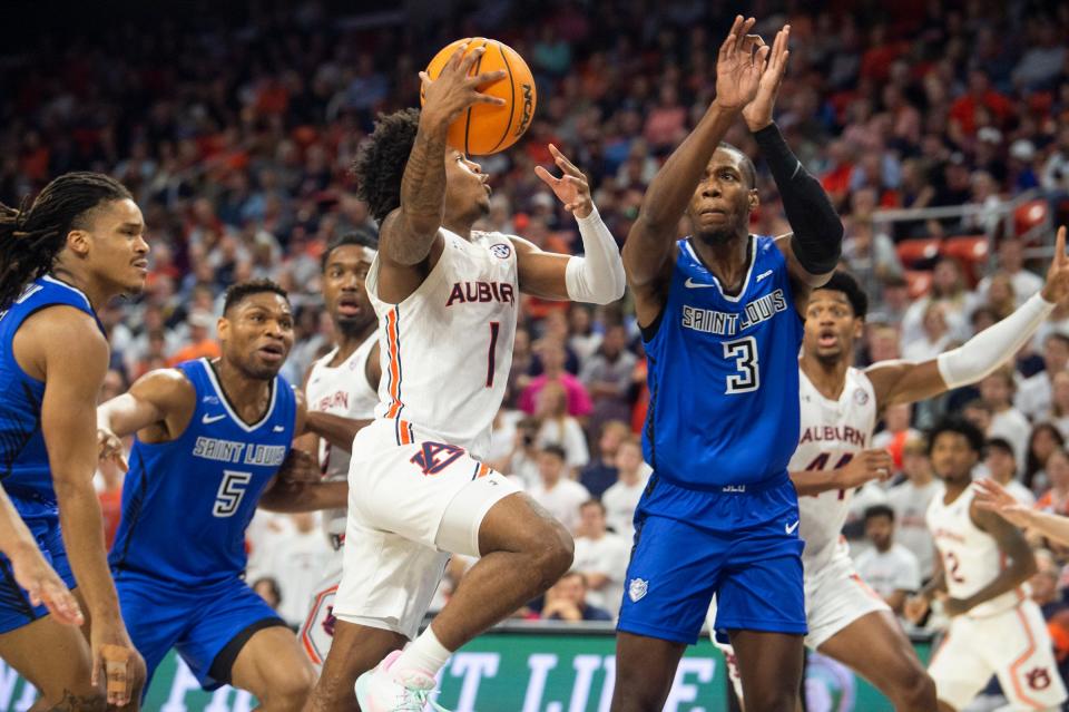 Auburn Tigers guard Wendell Green Jr. (1) goes up for a layup as Auburn Tigers takes on St. Louis Billikens at Neville Arena in Auburn, Ala., on Sunday, Nov. 27, 2022. Auburn Tigers lead St. Louis Billikens 36-33 at halftime. 