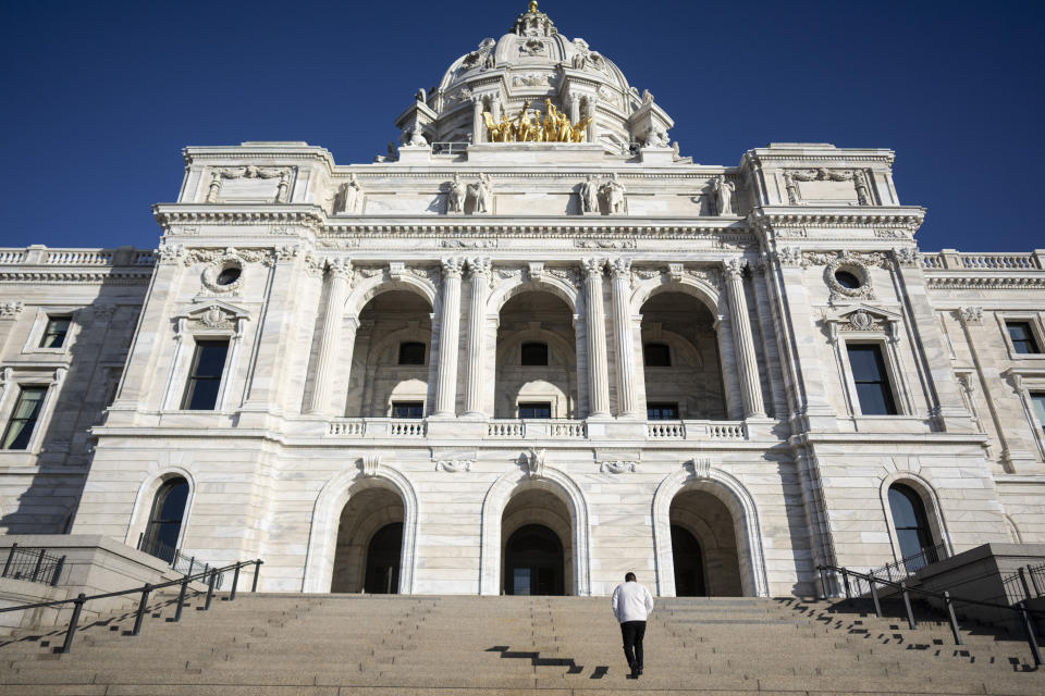 People walk into the State Capitol the first day of 2024 Minnesota Legislature session on Monday, Feb. 12, 2024 in St. Paul, Minn. (Renée Jones Schneider/Star Tribune via AP)