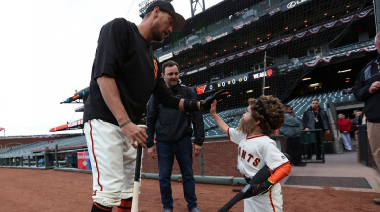 Hunter Pence meets his most devoted fan and mini clone, Charlie Teague. (Twitter/@MLB)