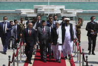 President Ashraf Ghani, center, arrives to attend an extraordinary meeting of the Parliament in rightKabul, Afghanistan, Monday, Aug. 2, 2021. (AP Photo/Rahmat Gul)